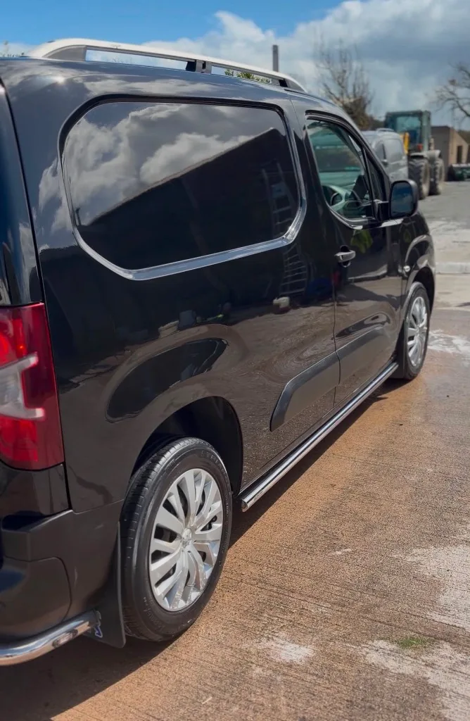 Black passenger van after valeting in Newry