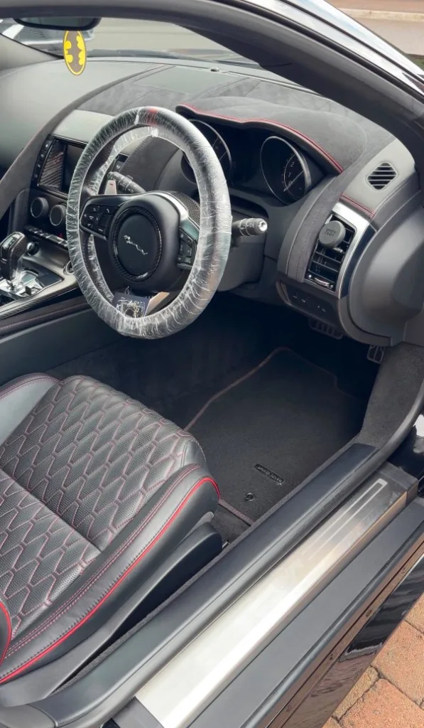 Jaguar interior with red stitching after valet in Drogheda