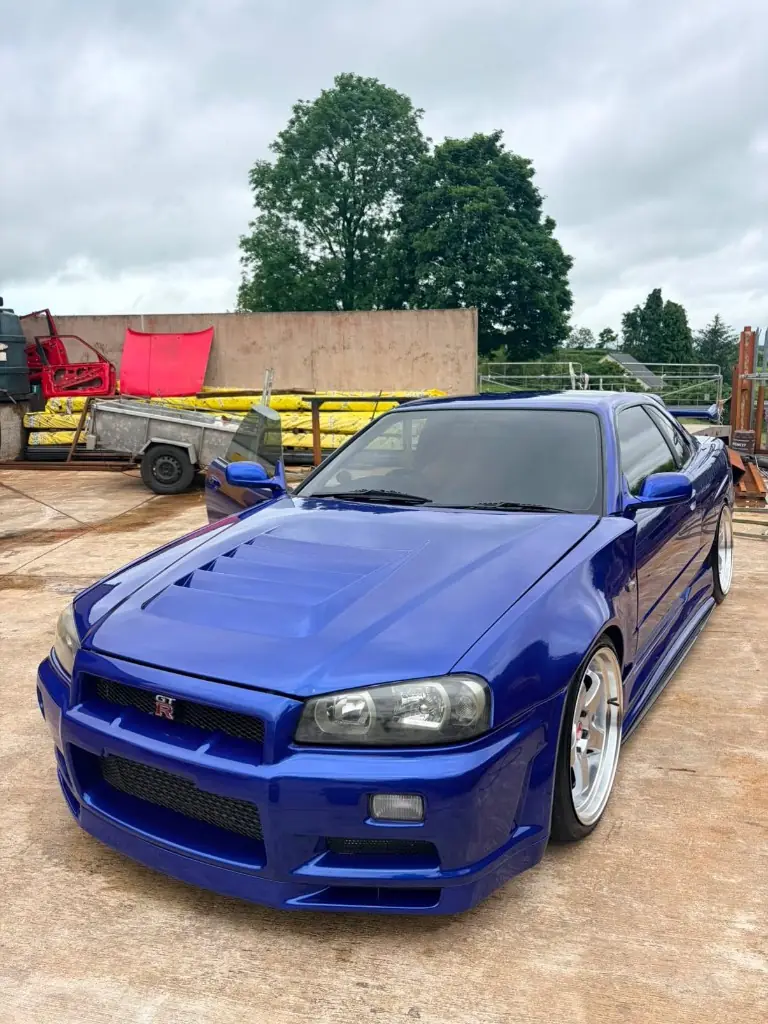 Blue Nissan Skyline R34 GT-R front view